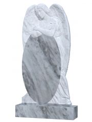 Памятник из мрамора с ангелом за стеной
